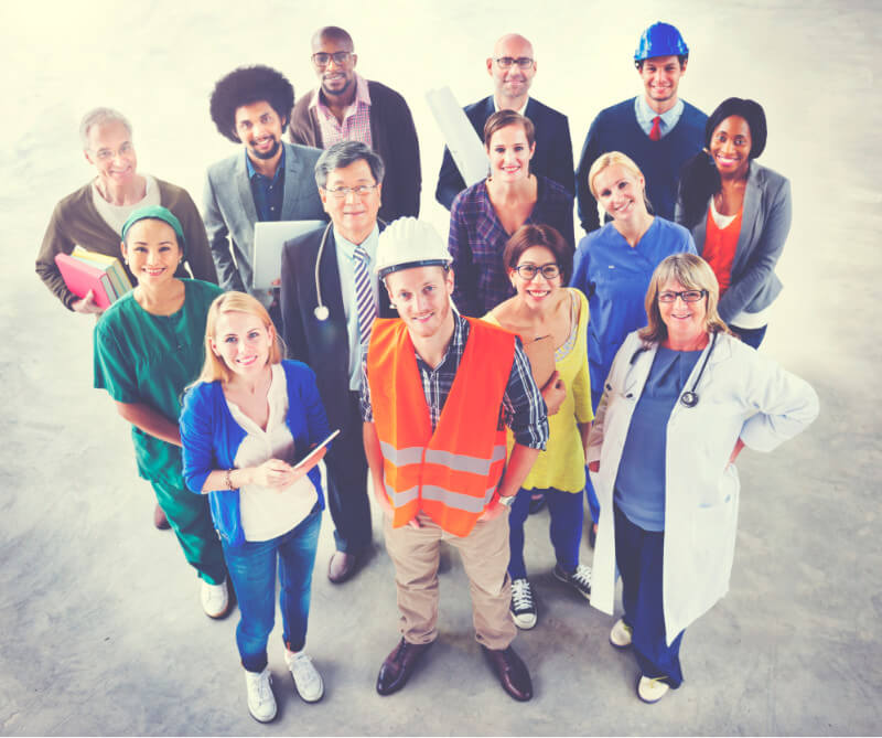 A group of different types of workers looking up.